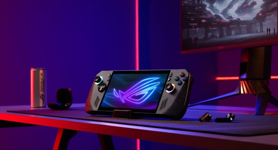 Perangkat gaming handheld berwarna hitam, ROG Ally X di atas meja